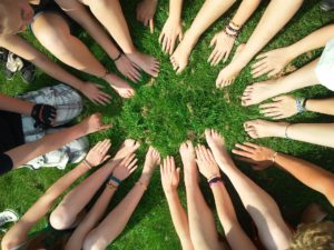 Hands and Feet on grass: Build A Course Community